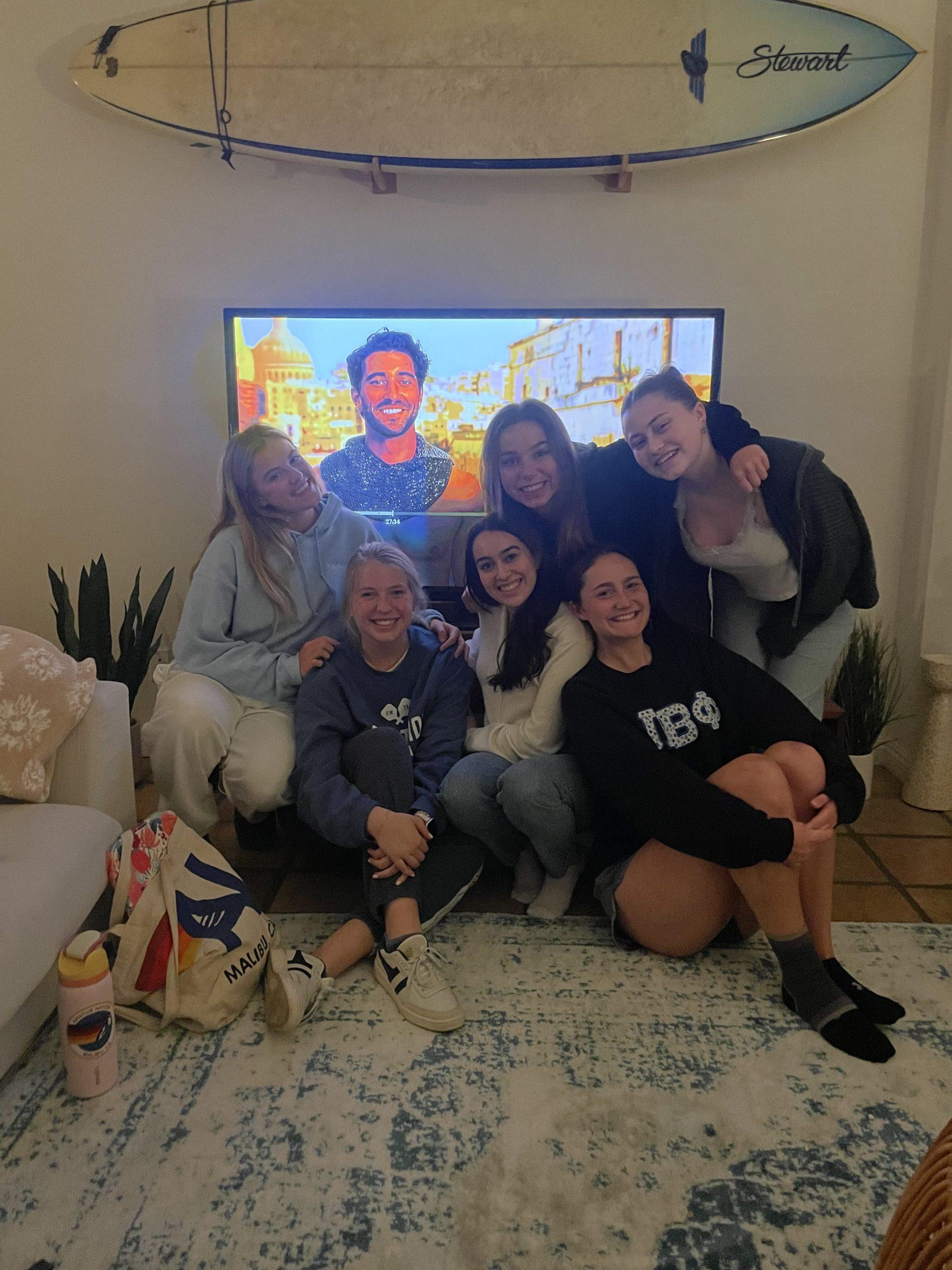 Avrey Roberts (left) joins her group of six, The Bachelor Baddies, at her friend's house March 11. Roberts said they met each week since the first episode to catch up and watch the show together. Photo courtesy of Avrey Roberts