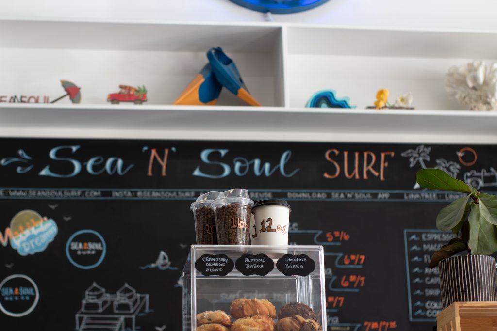 The coffee bar and menu at Sea N&squot; Soul Surf features hot and cold drinks as well as fresh pastries March 31. Manager Rachel Liakos said she crafted a special drink only available at Sea N&squot; Soul called "The Dirty Blue." Photos by Amanda Monahan