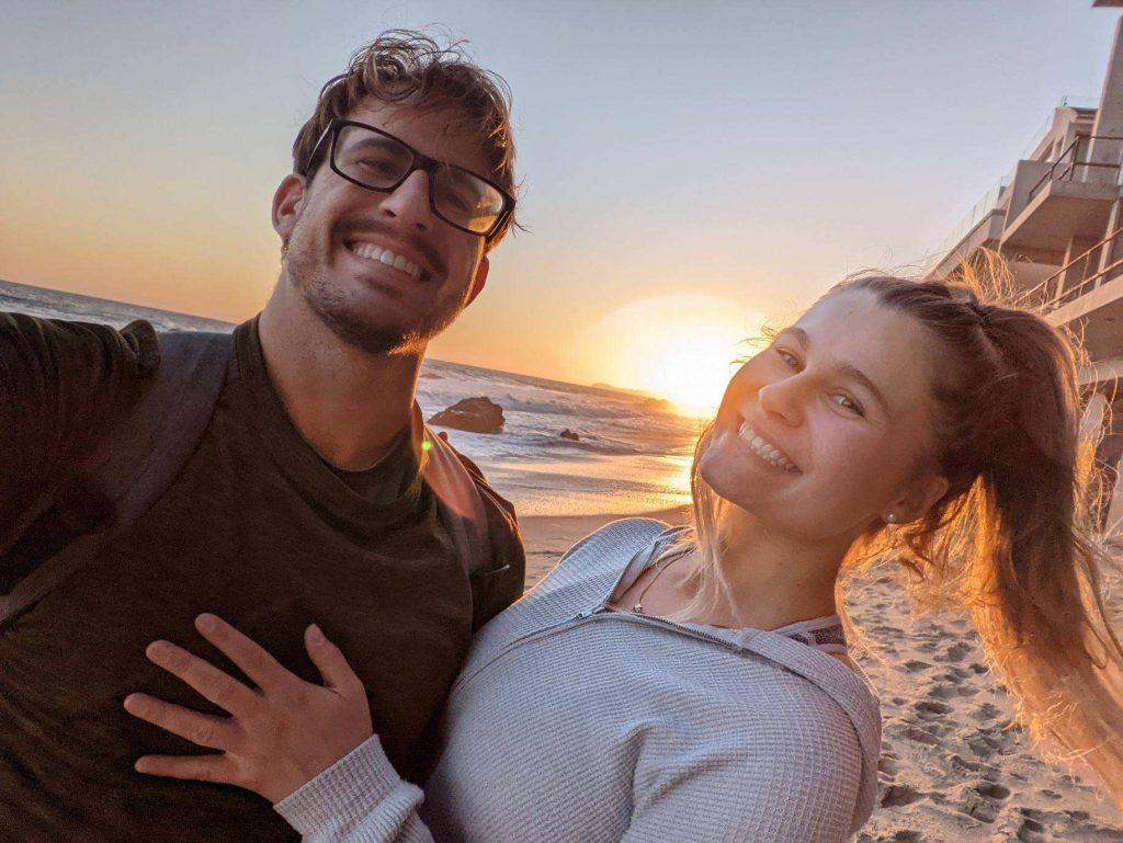 Senior Brandon Olson and Kira Landis pose on Ralphs Beach during sunset. The couple said they share a lot of the same interests and love doing everything together. Photo courtesy of Kira Landis