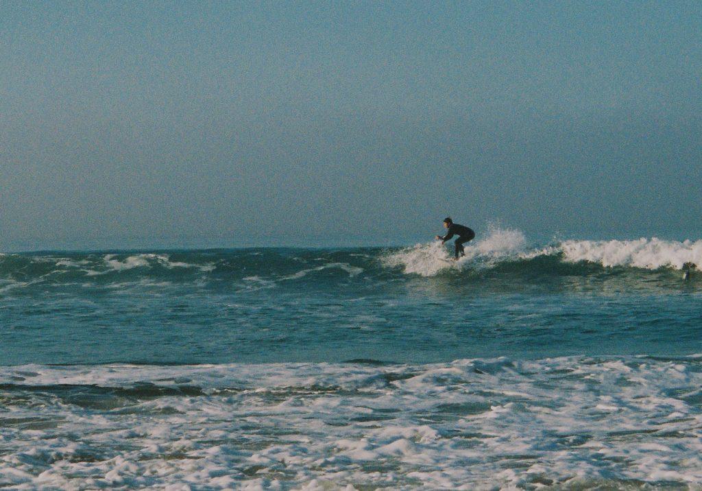 Sophomore JT Longoria sides a wave Jan. 31, at Zuma Beach. This was just one of the many waves that Longoria caught.