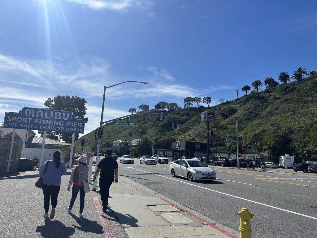 Tourists walk along Pacific Coast Highway on March 10, to get to the Malibu Pier. Many tourists said they don’t know that PCH is considered dangerous. Photos by Abby Wilt
