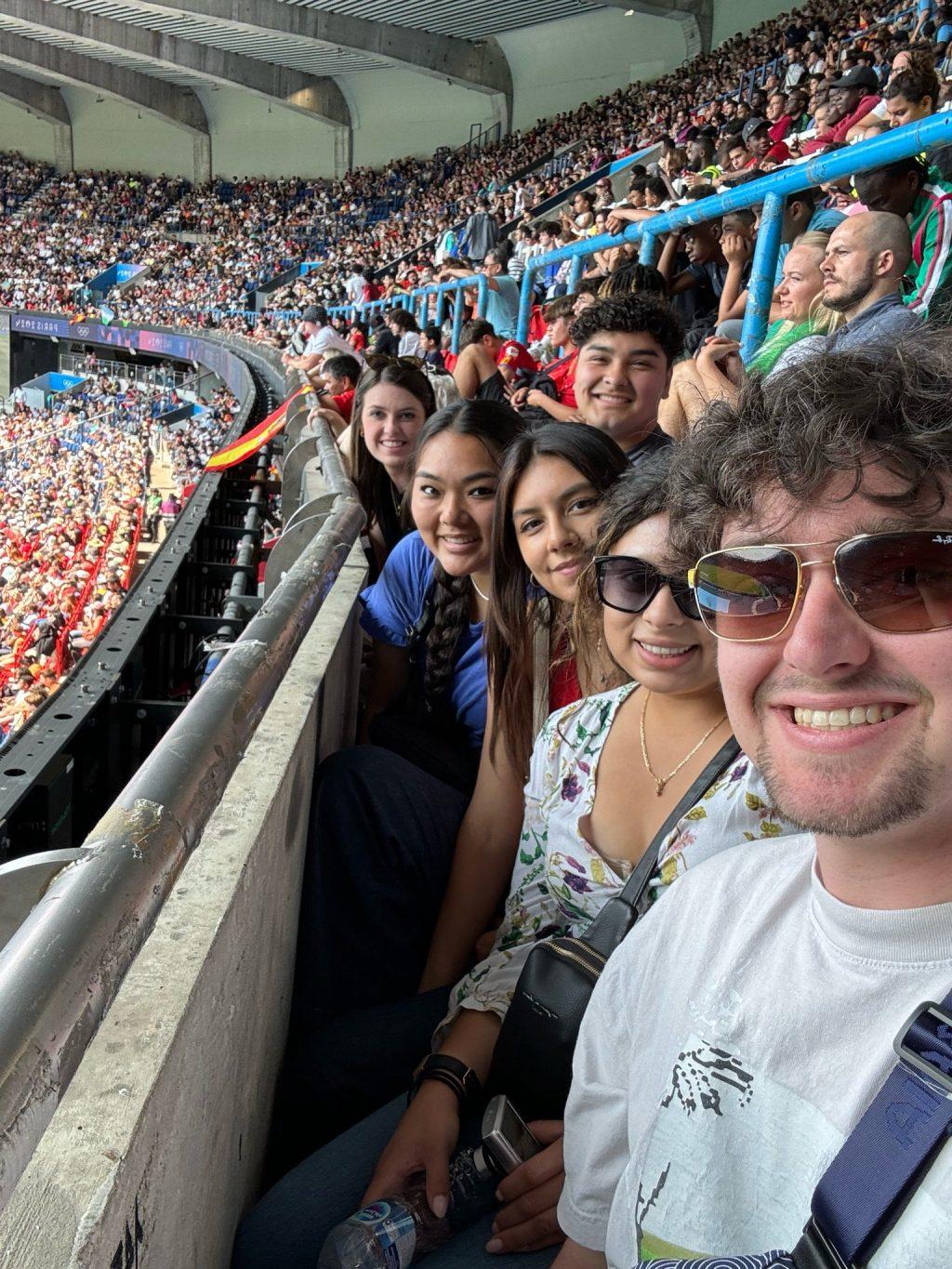 (From Right to Left) Paris program students William Alhadeff, Xaree Reyes, Diana Escobar, Alexis Morada, Christian Anaya and Kennedy Duke in attendance for an Olympic football match between Uzbekistan and Spain on July 24. Spain came out on top with a 2-1 victory over Uzbekistan. Photo Courtesy of William Alhadeff