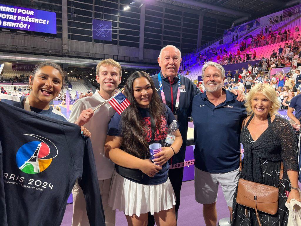 (From Left to Right) Kaitlyn Gavidia, Austin Yerke, Alexis Morada, Marv Dunphy, adjunct professor Ben Price and his wife, Anthy Price pose for a photo together at the Women's Volleyball event for the Olympic Games on July 31. Dunphy, former Pepperdine Men's Volleyball Head Coach emeritus, made his ninth appearance in the Games, Erving time with both the Men's and Women's Team USA Volleyball teams. Photo courtesy of the Paris program