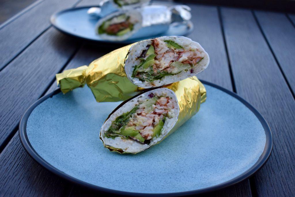 A popular Howdy's signature sushi burritos is wrapped in golden foil and on display April 11. The Howdy's menu consists of both Mexican cuisine classics and sushi dishes. Photos by Mary Elisabeth