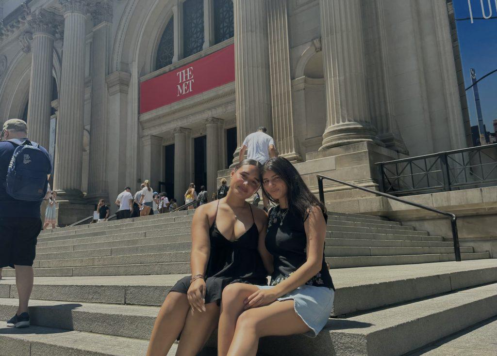 Sophomores Adrianne Mercado and Bardalis Sanchez Jimenez sit on the steps leading up to The Metropolitan Museum of Art in New York City on July 11. Mercado said despite having a packed schedule throughout her entire trip, she was thrilled to be able to see so many new places. Photo courtesy of Adrianne Mercado