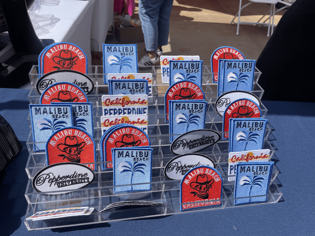 DIY patches sit on display at the SGA booth at the NSO Block Party in Mullin Town Square on Aug. 16. Students were able to select one patch and one hat for their customized swag.