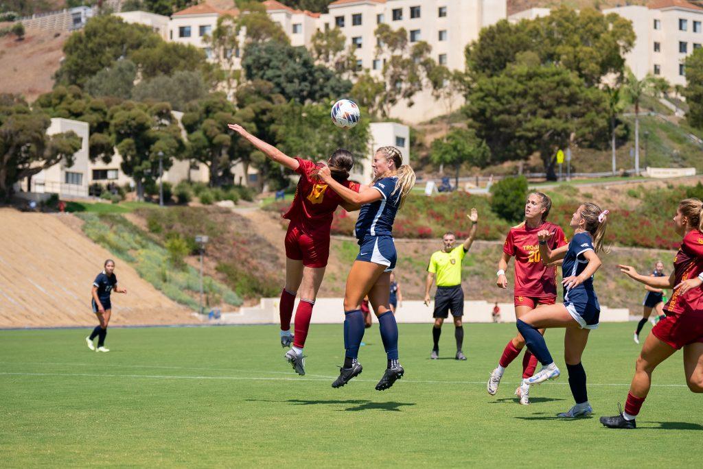 Sophomore defender Peyton Leonard goes for a header against USC on Aug. 25, at Tari Frahm Rokus Field. Leonard has tallied 307 minutes played for the Waves so far this season, leaving a strong defense presence on the field.