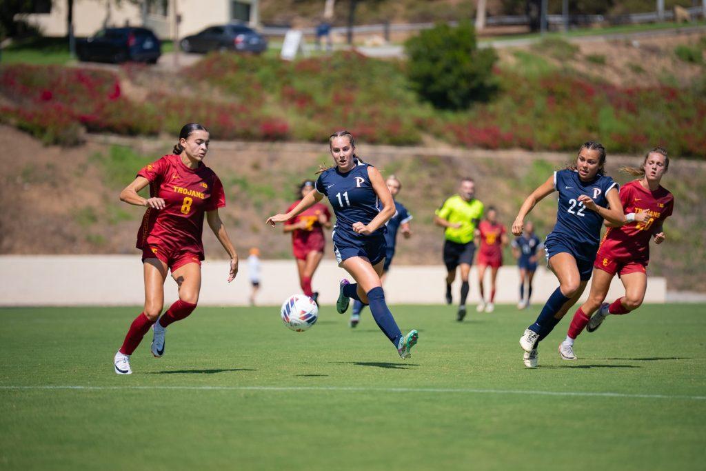 Junior midfielder/forward Tatum Wynalda and sophomore forward Julia Quinonez rush toward the ball in a match against USC on Aug. 23, at Tari Frahm Rokus Field. Wynalda came off the bench for this match, however, she stepped onto the field with an intensity that changed the style of play for the Waves altogether.