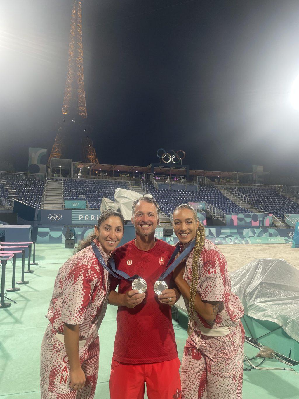 Women's Beach Volleyball Head Coach Marcio Sicoli captured with his Canadian duo of Wilkerson and Humana-Paredes following their silver medal finish Aug 9. at the Paris Olympics. This is Sicoli's third appearance at the Olympic Games, winning gold in '12 and silver in '16. Photo courtesy of Pepperdine Athletics