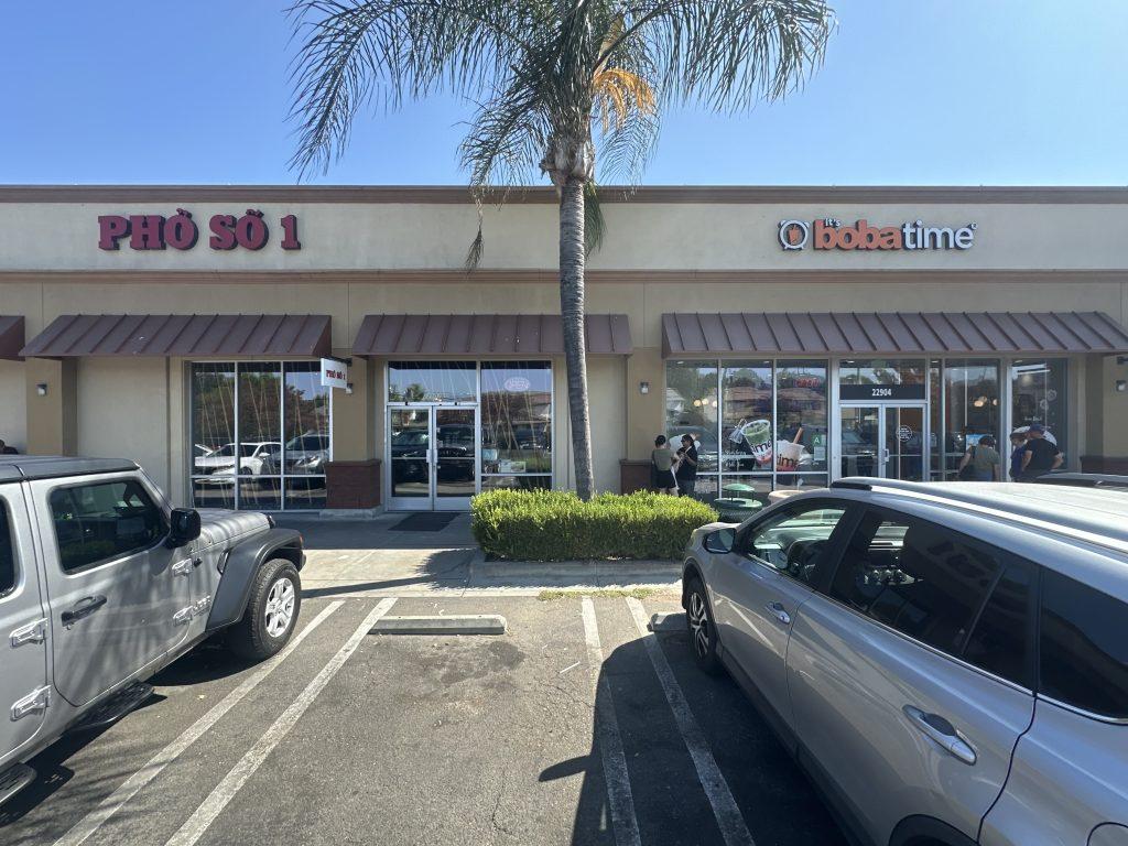 Customers stand outside Pho So 1 and It's Boba Time's adjacent storefronts Aug. 25. The pho spot has five locations in the San Fernando Valley. Photo by Henry Adams