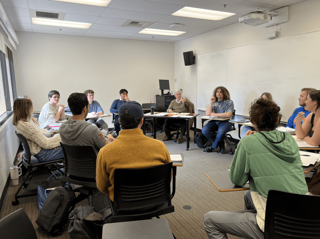 Professor Paul Contino converses with Great Books students during their class time on the third floor of the CAC on Feb. 9. Contino opened the class with a prayer before the group dove into a conversation about their most recent reading.