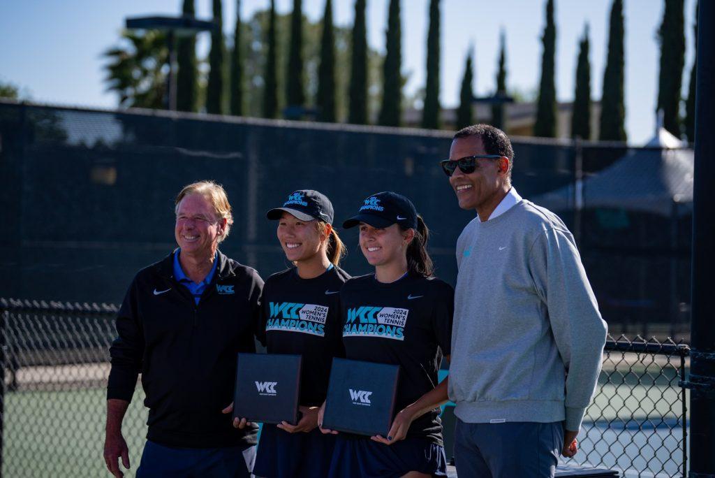 Yang [second from the left] and Redelijk [third from the left] pose after winning the 2024 WCC Women's Tennis Championship on April 27. Yang and Redelijk won in No. 2 doubles position to clinch doubles points for the team. Photo courtesy of Nikki Redelijk