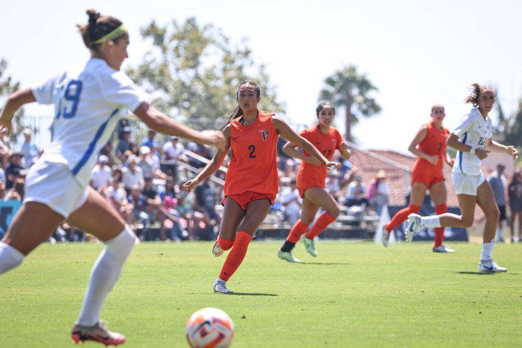 Freshman midfielder Ariana Salvador stares down a UCLA Bruin who is attempting a drive down the field Sept. 1 at Tari Frahm Rokus Field. Pepperdine's defense was led by a press that the Bruins could not penetrate to score.