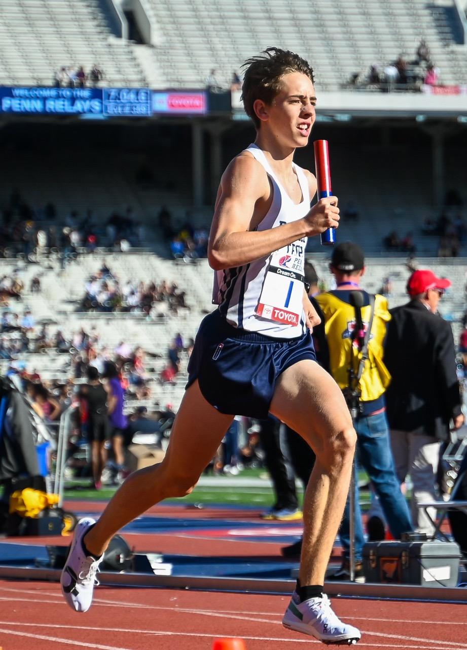 Freshman middle distance runner Elijah Gentry runs in a race at Brooklyn Tech High School in the High School Boys’ Distance Medley Relay Championship of America in Philadelphia on April 26. Gentry is a middle distance runner and is looking forward to his first cross country season as a Wave. Photo courtesy of Elijah Gentry