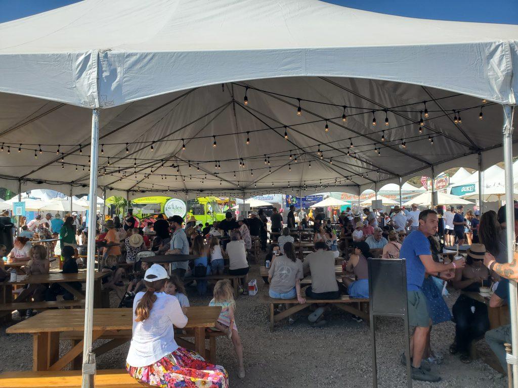 Contestants of the Malibu Chili Cook-Off gather in the shade on September 1st for a chance to taste one of the eight contestants' chili bowls. Voting for the People's Choice Award was open Friday through Sunday. Photos by George Davis