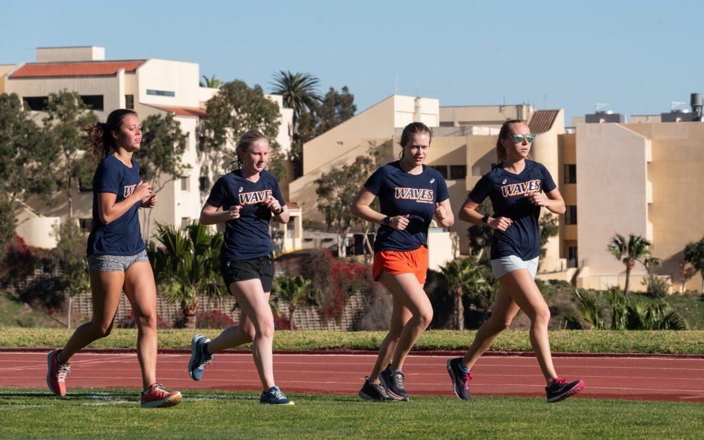 Both Men and Women's Cross Country runs on the grass due to the conditions of the track in the last few seasons before the renovations. Both Pepperdine teams planned to have all practices on the new track this season. Photo courtesy of Pepperdine Athletics