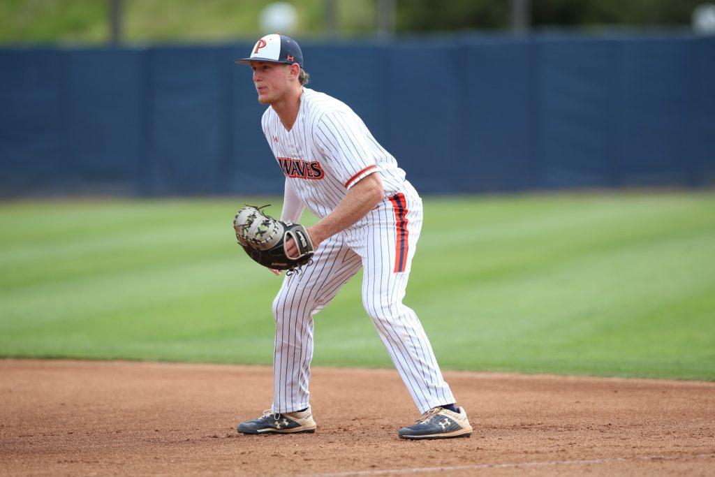 Billy Cook, alumnus ('21) and former Pepperdine Baseball infielder ('18-'21), on the diamond playing first base for the Waves, at Eddy D. Field Stadium. Cook would also play first base in his Major League debut. Photos courtesy of Pepperdine Athletics