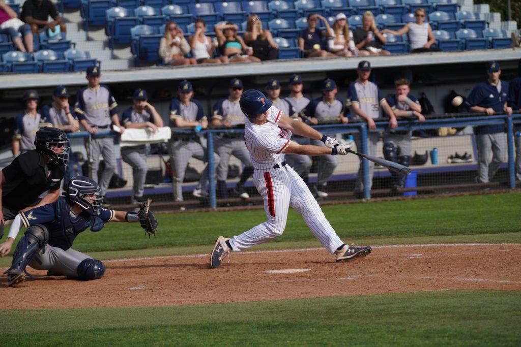 Cook readies an explosive swing against the University of Akron on Feb. 20, 2020, at Eddy D. Field Stadium. Cook's swing resulted in a 389-foot homer, ending the short '20 campaign with four.