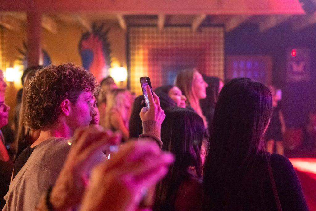 A Pepperdine student photographs Zamani's performance Sept. 12. He was one of the many Waves in attendance.