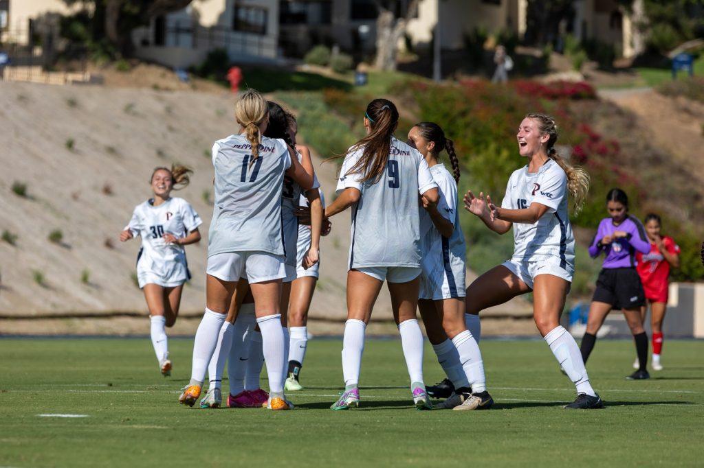 The team celebrates sophomore midfielder Kyra Murphy's goal, against Fresno State on Sept. 20, at Tari Frahm Rokus Field. Pepperdine won, outshooting Fresno State 11 to 2. Photos by Colton Rubsamen