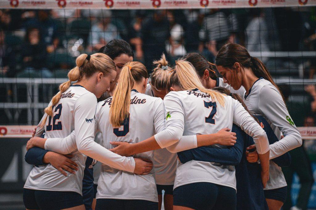 Women's Volleyball huddles together in their second match against Hawaii at SimpliFi Arena at Stan Sheriff on Sept. 7. Although the Waves lost the second match, they were able to beat the Rainbows on Sept. 6 for the first time at Hawaii since 1997.