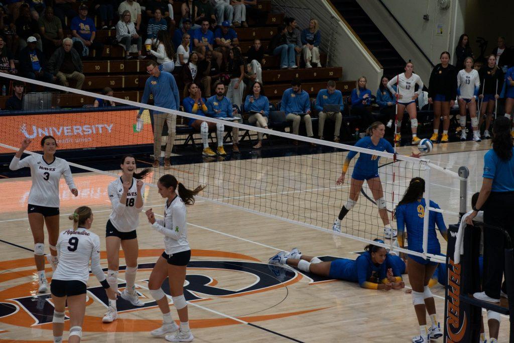 Women's Volleyball celebrates after scoring a point against No. 1 Pitt on Sept. 13, at Firestone Fieldhouse. The Waves lost the series 3-0.