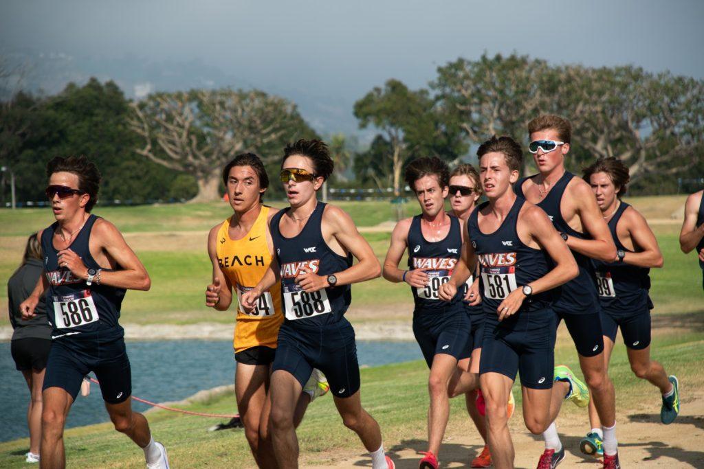 Sophomore runner Gordy Nilsen alongside his Cross Country teammates as they compete in the Waves Invitational on Aug. 30. For the first time since high school, Gordy and his twin brother Rowan are running as teammates.