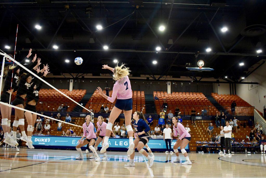 Graduate student outside hitter Birdie Hendrickson hits past a Santa Barbara block at Firestone Fieldhouse on Sept. 15. Hendrickson was a key scorer in putting the Waves on top in their last Asics Classic Tournament Game.