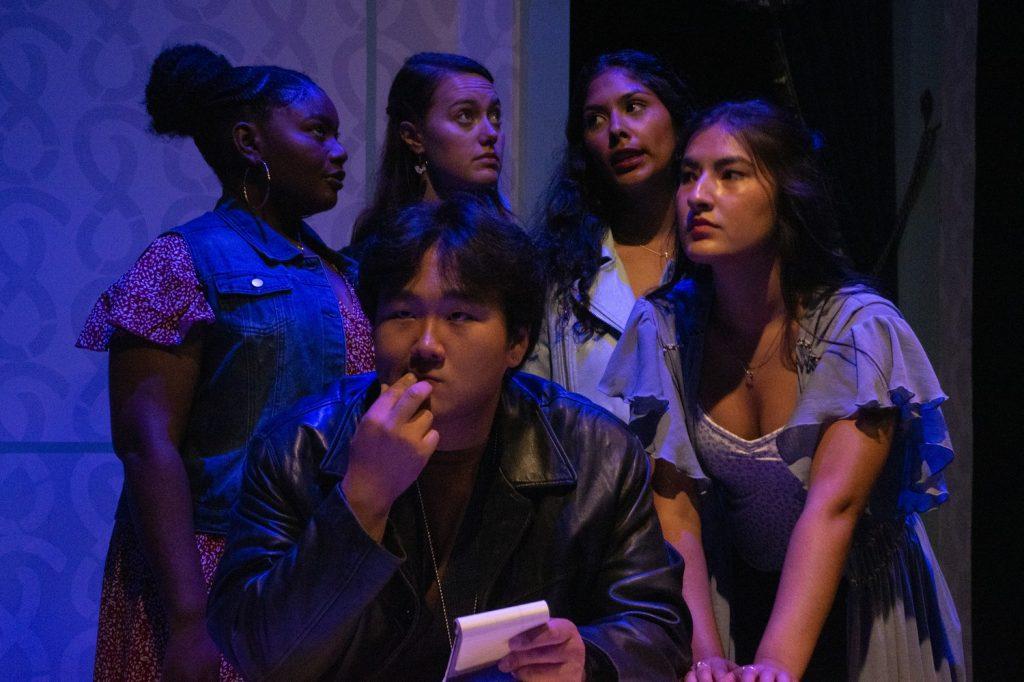 Wendy Darling contemplates to the right of her inner monologuers while in conversation with a detective at a Sept. 22 rehearsal. Wendy’s emotions could often be read by looking at the three other girls’ faces. Photos by Perse Klopp