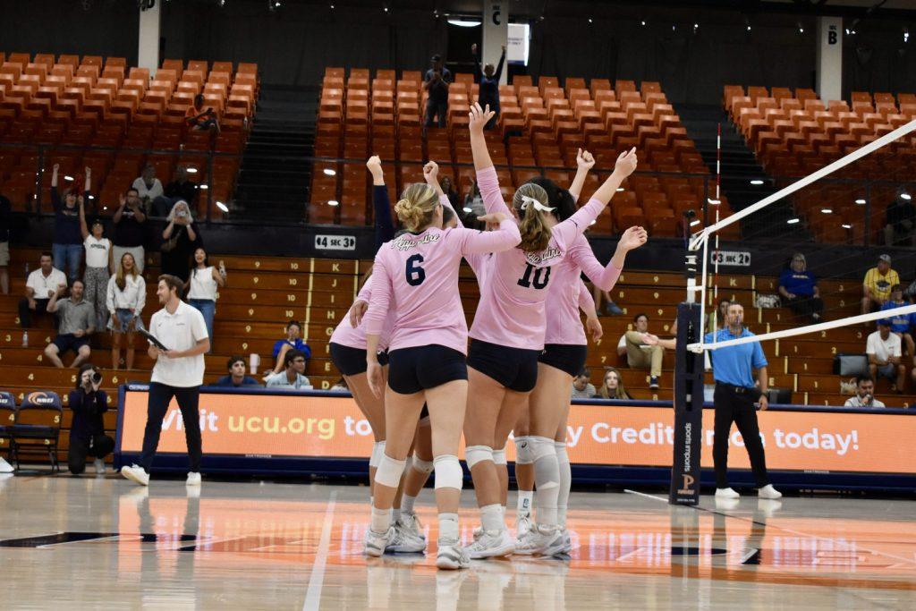 Women's Volleyball comes together to cheer after securing a point against UC Santa Barbara on Sept. 15 at Firestone Fieldhouse. The Waves won the match 3-0 for a revenge sweep from last year's loss against the Guachos.