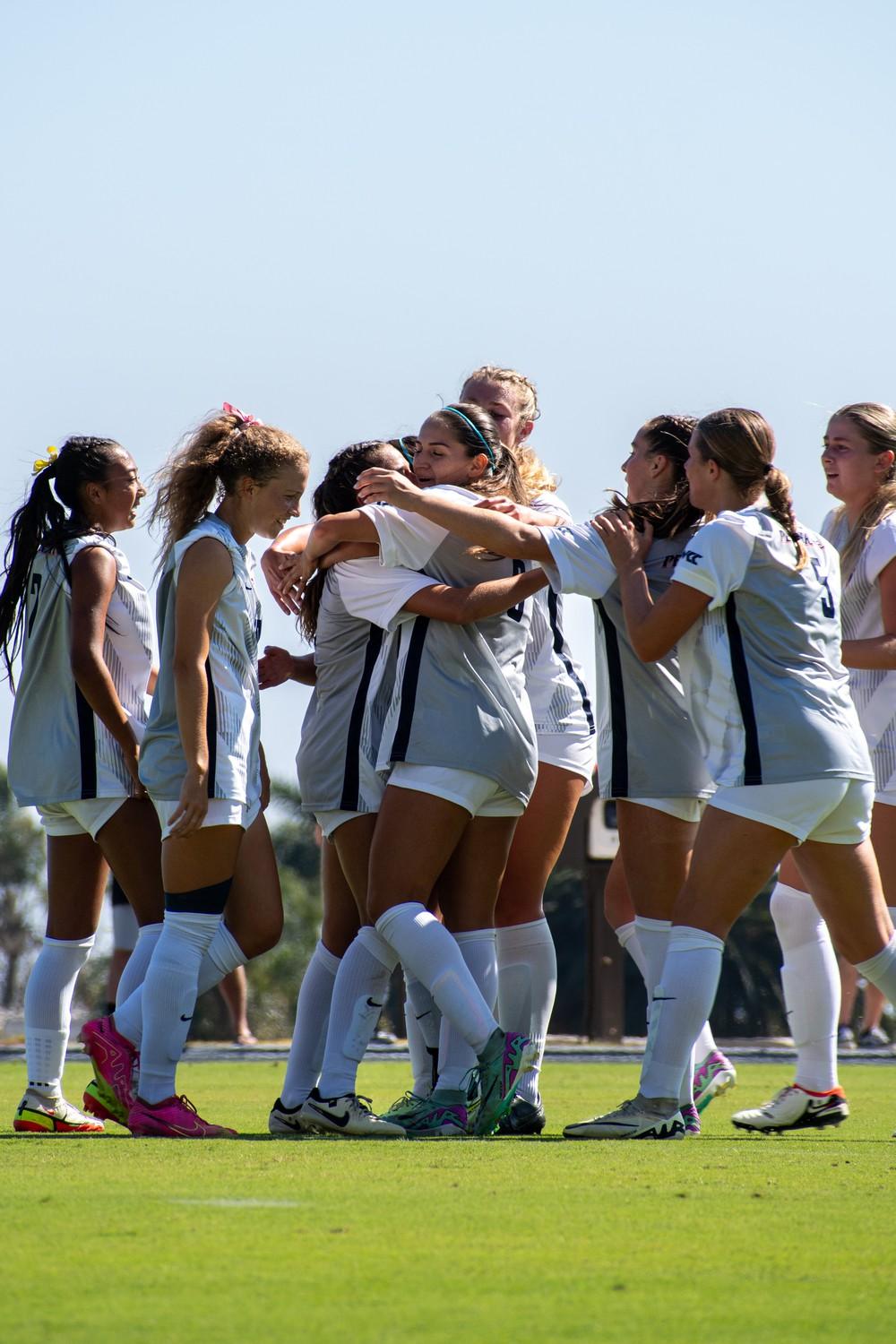 Tabitha LaParl, redshirt junior midfielder/forward, celebrates with her teammates after scoring a goal against Arizona on Aug. 29, at Tari Frahm Rokus Field. Pepperdine put in an impressive first half performance outshooting Arizona six to one.