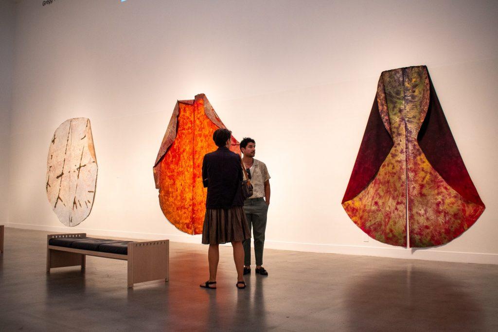 Attendees walk through first floor of the Weisman Museum on Sept. 7. This portion included the opening of Cameron Harvey's work for her first solo exhibit. Photo by Colton Rubsamen.