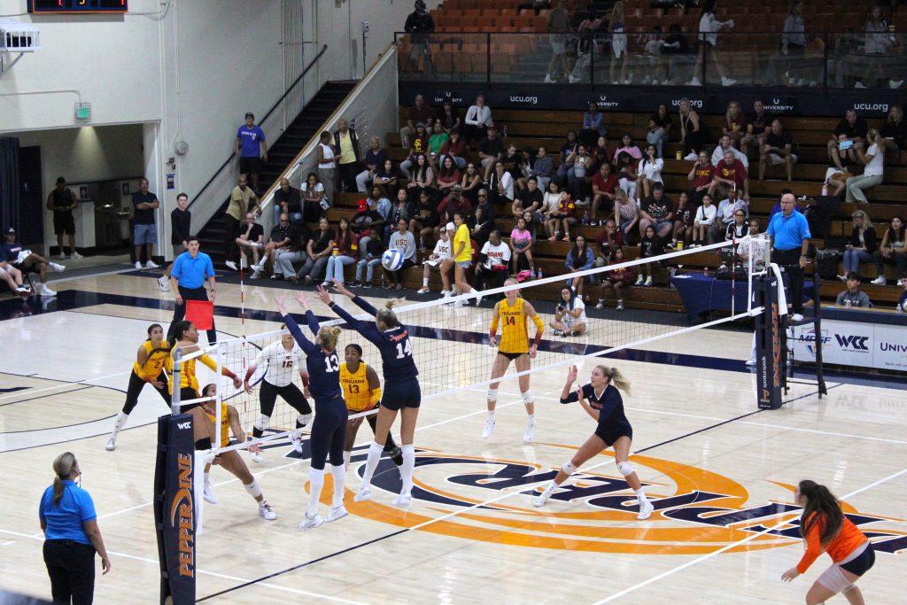 Simpson and senior middle blocker Kenadie Patterson go for a block against USC on Sept. 1, at Firestone Fieldhouse. Patterson accumulated 7.5 points for the Waves, tied for the Waves third-best that game, while tallying a .250 hitting percentage.