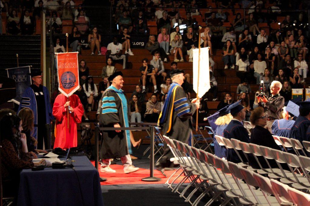 Faculty and staff process in to Firestone Fieldhouse on Sept. 18. They participated in the Founder's Day processional march.