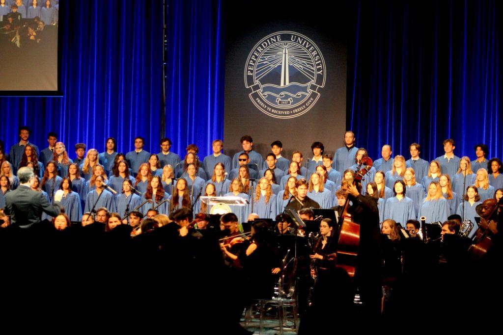 The Pepperdine choir and orchestra at Founder&squot;s Day at Firestone Fieldhouse on Sept. 18. They performed two songs, "God of our Fathers" and "We Will Climb." Photos by Riley Haywood