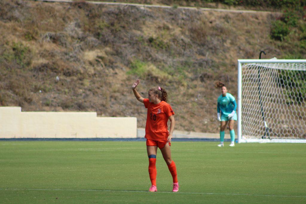 Graduate student midfield/forward Tori Waldeck raises her hand to call for the corner kick play against Cornell on Sept. 22, at Tari Frahm Rokus Field. Waldeck was a celebrated senior last season, scoring a goal against Portland on Oct. 22. Photos by Riley Haywood