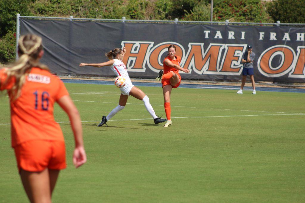 Freshman defender Lily Stewart dishes out a pass toward the midfield against Cornell on Sept. 22, at Tari Frahm Rokus Field. This is the freshman's ninth-consecutive game she's started and just one of the rising youth stars on Women's Soccer.