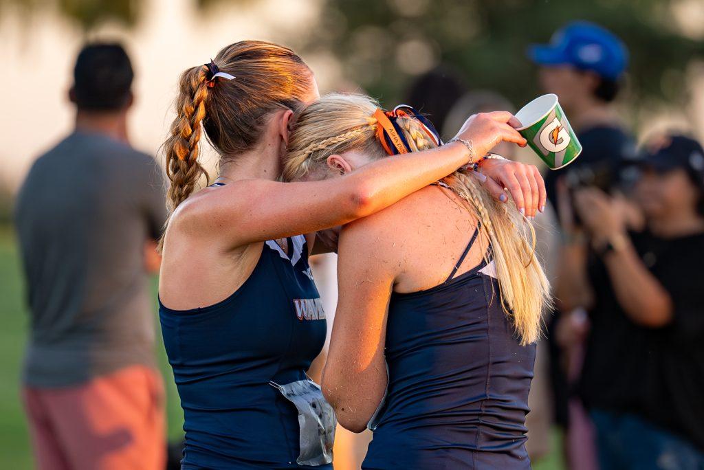 Emma Martinez (left), sophomore cross country runner and Graphic News Writer, and sophomore cross country runner Kayla Renner (right) embrace following their 6k race Sept. 20, at the Micke Grove Golf Course. For their second race of the year, both the men's and women's team ramped up their distances to an 8K and 6K, respectively. Photos courtesy of Pepperdine Athletics