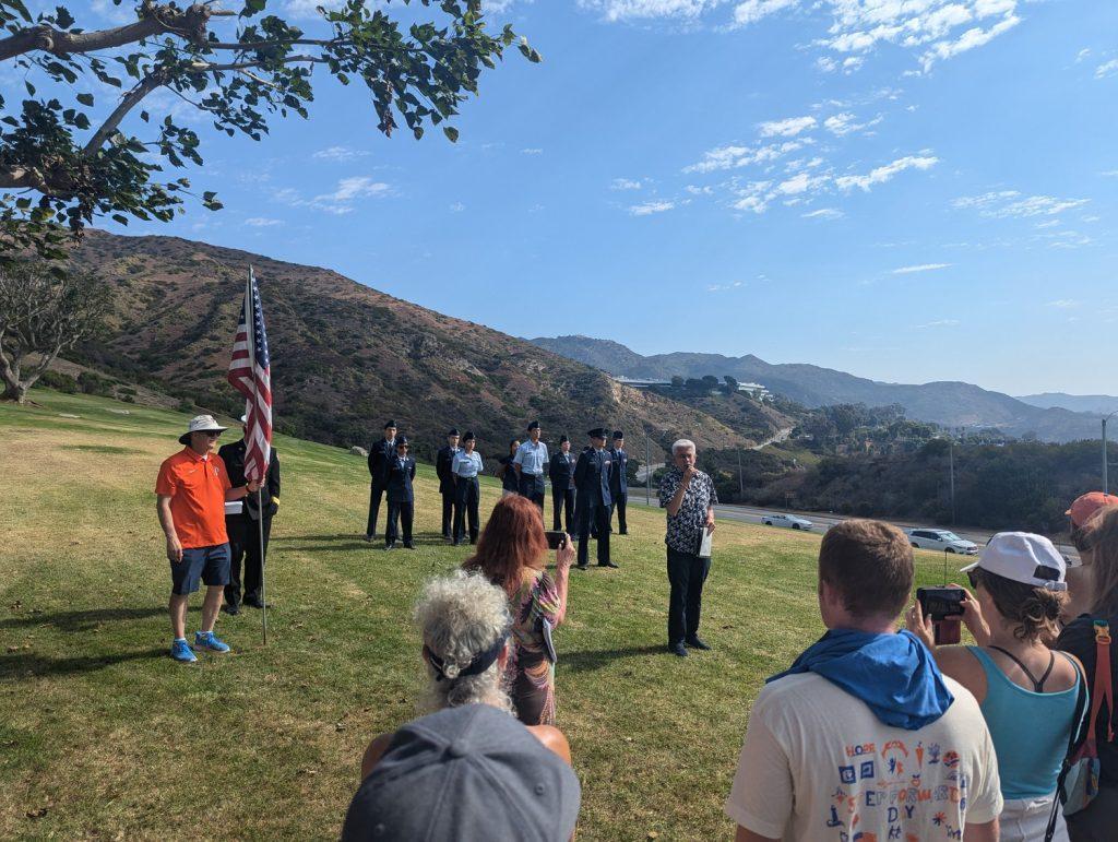 President Gash and military members participate in a ceremony at Alumni Park Sept. 7. Gash hopes the Waves of Flags encourages students to live lives of service.