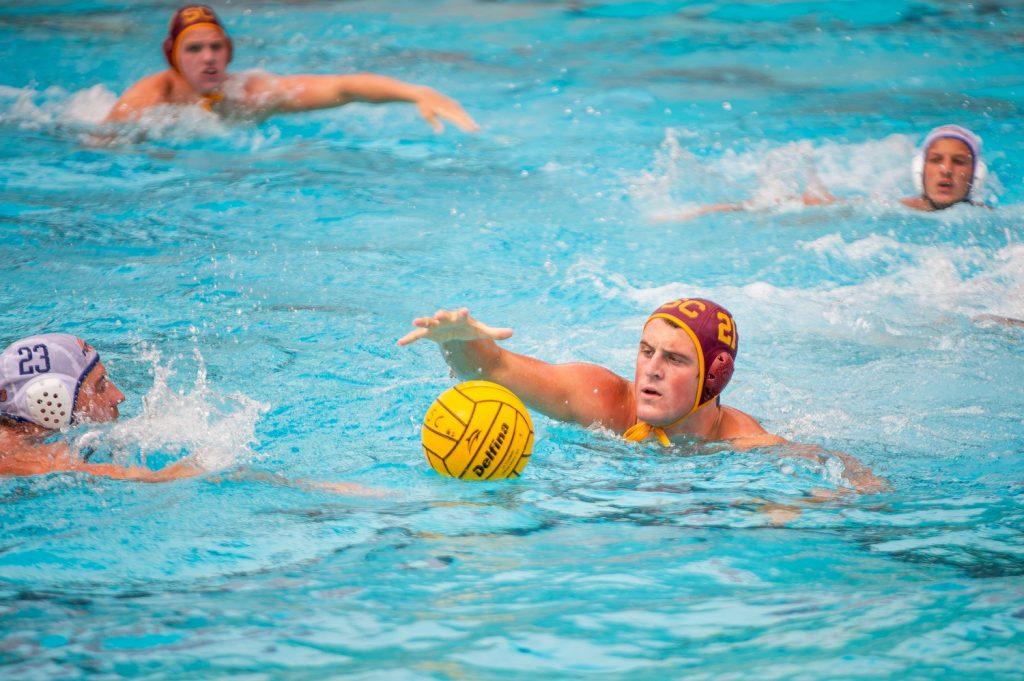 Junior attacker Adam Csapo and USC senior 2-meter offensive player Connor Cohen battle for control of the ball Sept. 15, at Uytengsu Aquatics Center. Csapo opened the scoring for the Waves and also topped to leaderboard with five goals.