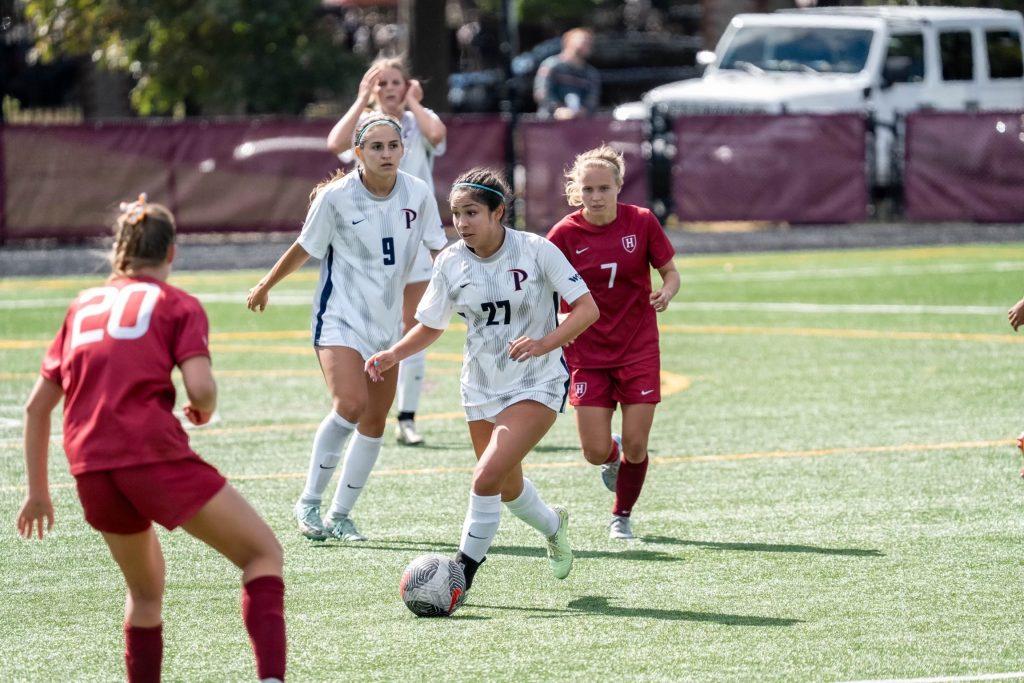 Junior midfielder Karina Gonzalez dribbles the ball during Sunday's non-conference match against Harvard on Sept. 8 at Jordan Field. Gonzalez has played 90 minutes in the Waves' last seven games. Photos courtesy of Harvard Athletics