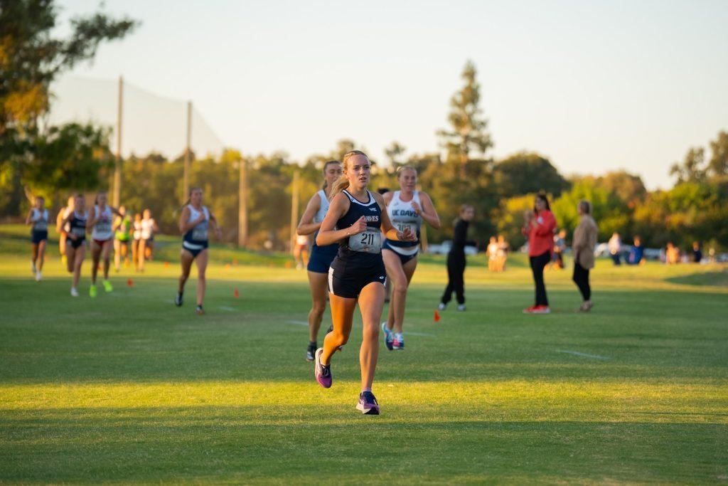 Sophomore cross country runner Lizzy Crawford pushes through a lap during the Pacific Invite on Sept. 20, at the Micke Grove Golf Course. Crawford secured her seventh-straight top finished for Women's Cross Country during this race.