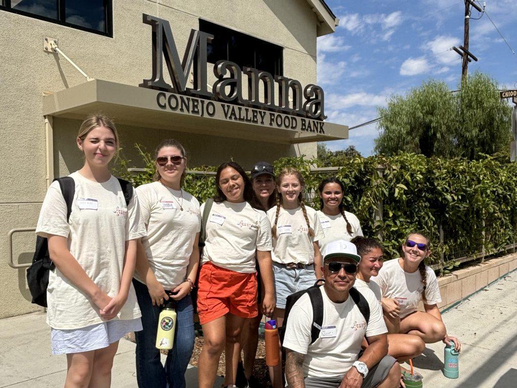 Pepperdine students smile at the Manna Conejo Valley Food Bank on Sept. 7. Students spent time organizing the food bins at the food bank. Photos courtesy of Saylor Stottlemyer