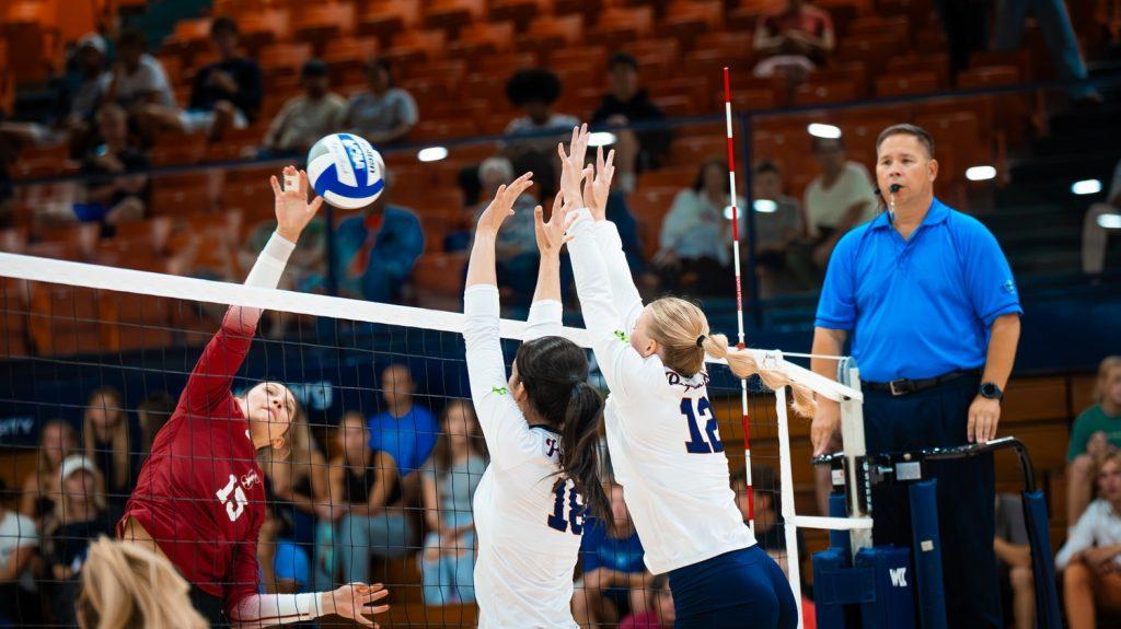 Freshman middle blocker Ella Piskorz and freshman outside hitter Maggie Beauer jump for a block against Stanford on Sept. 11 at Firestone Fieldhouse. Despite only being in their first year as members of Pepperdine Indoor Volleyball, they have been helping on the court against top teams.