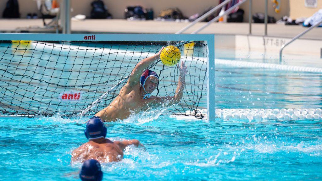 Freshman goalie Jaxon Leach blocks a goal against Loyola Marymount University at Raleigh Runnels Memorial Pool on Sept. 14. Leach finished the game with 10 saves and four steals.