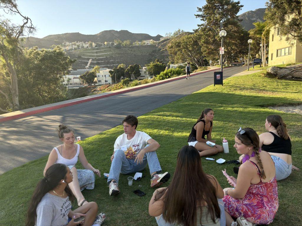 Students gathered around to get to know each other before the competition began. The Board provided free Wingstop and Crumbl Cookies for participants.