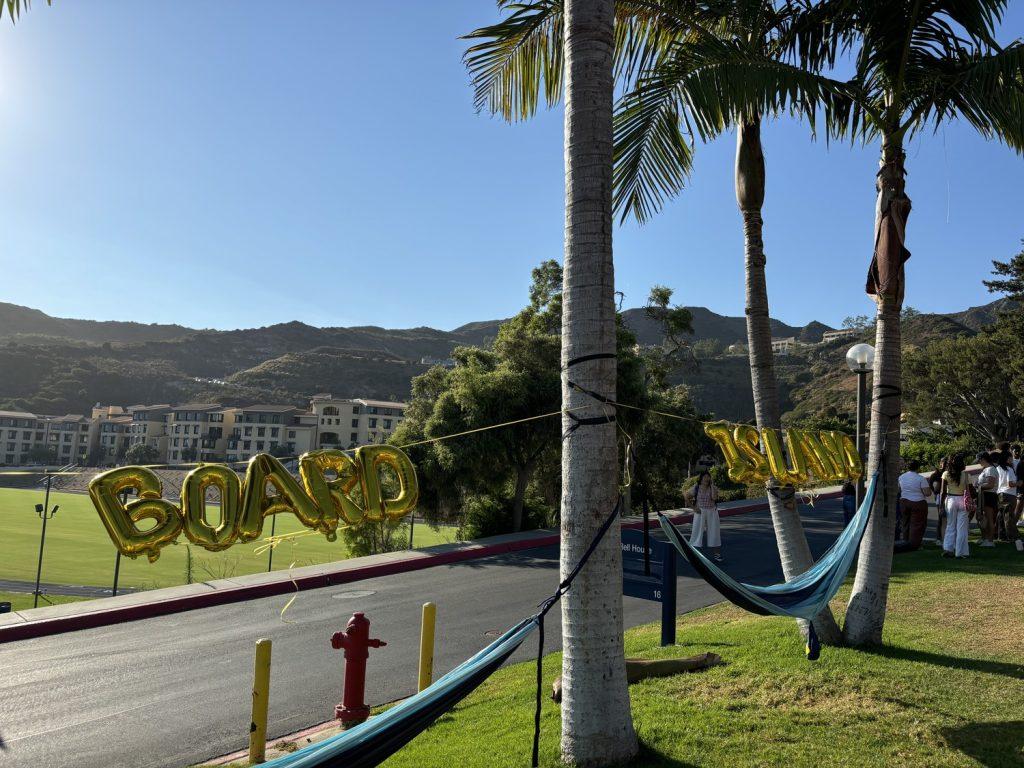 The Board event planners set up decorations to match the "Love Island" theme Sept. 6 at the Miller/DeBell beach volleyball court. Students enjoyed the balloons and used them as photo ops. Photos by Emma Martinez