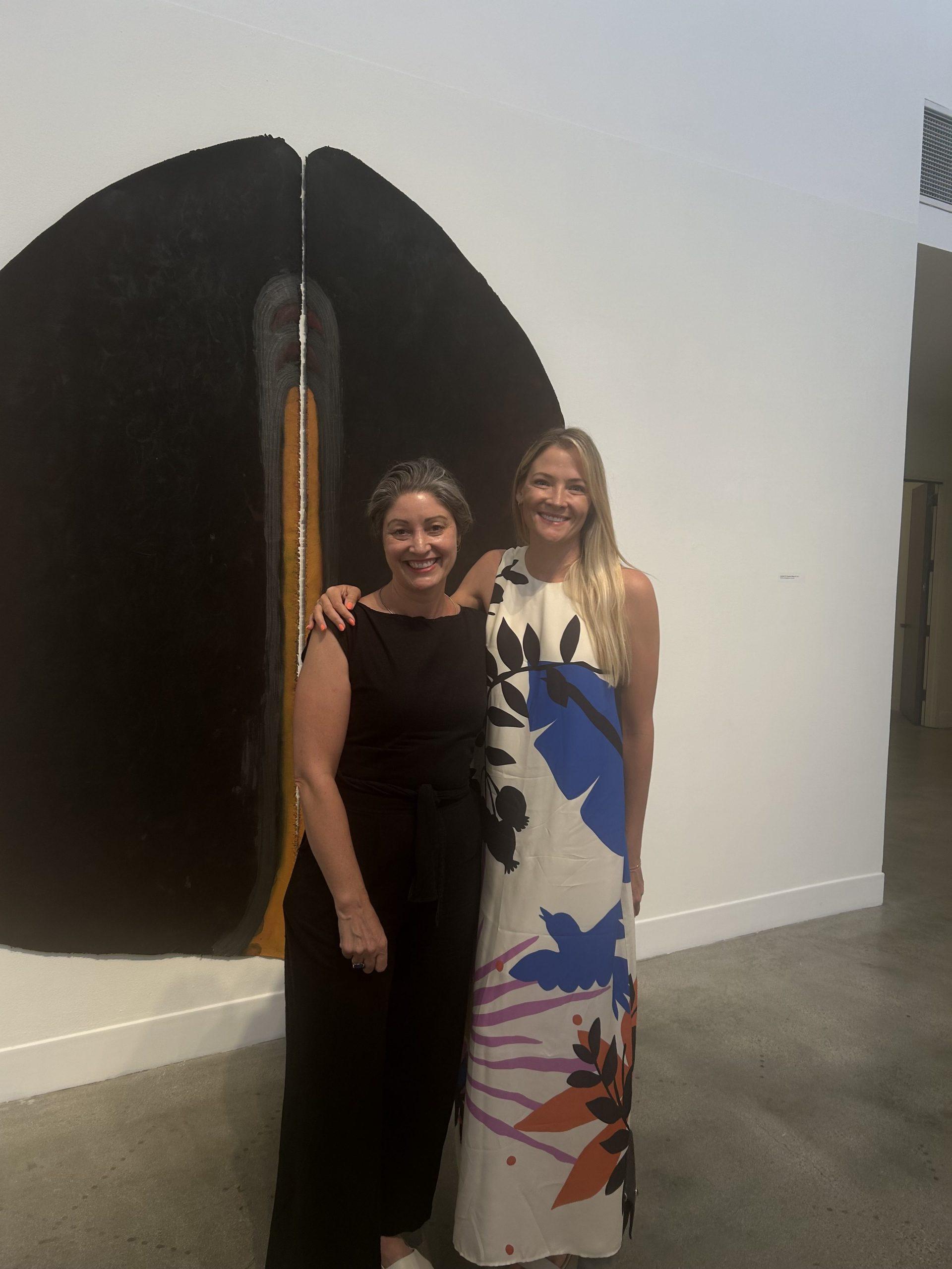 Artist Cameron Harvey (left) with friend Jenny Franzaak (right) stands in the center of "The Shape of Being" exhibit Sep 7. Harvey invited Franzaak to the event. Photo by Jade Gonzalez