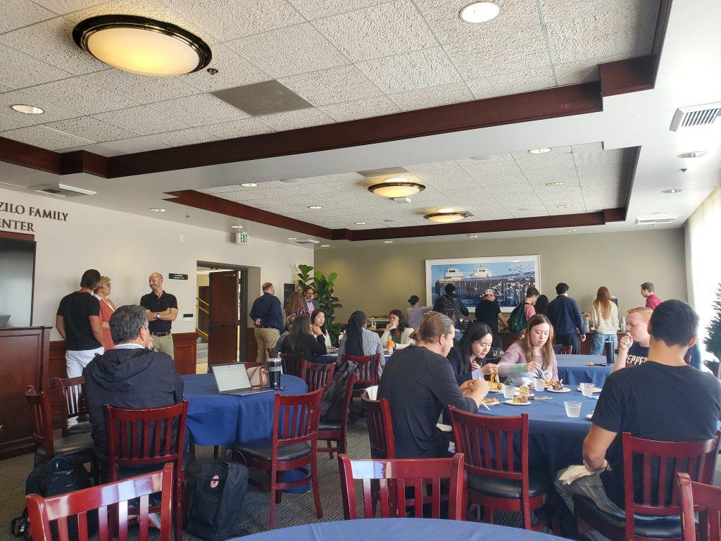 Students eat at Executive Center Dining Room before a Davenport Discussion with Almis Udrys on Sept. 23. It is the second Davenport Discussion of the semester, according to the website. Photo by George Davis