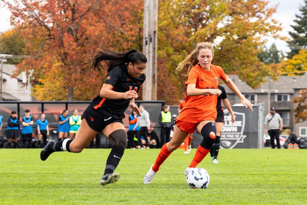 Graduate midfielder/forward Tori Waldeck maintains control of the ball against an Oregon State University defender Oct. 26 at Paul Lorenz Field. Waldeck's penalty kick goal brought the game to a tie, 1-1. Photos courtesy of Morgan Barnaby/Daily Barometer at Orange Media Network